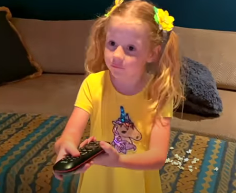nastya is watching a scary video on tv